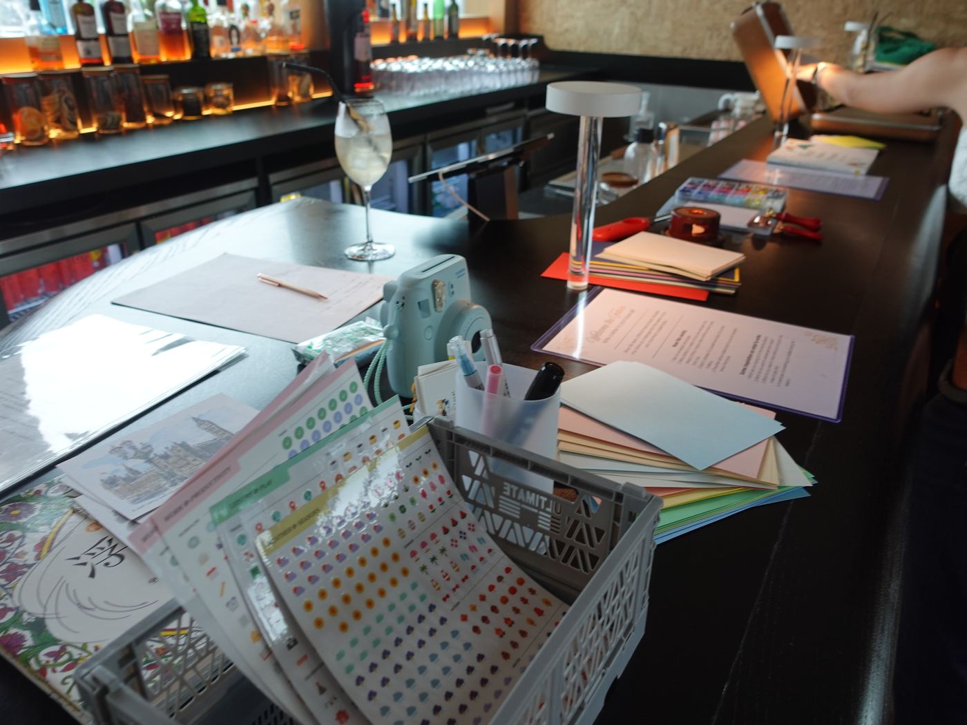 Stationery, stickers and cards laid out along the bar